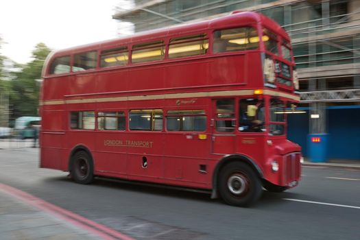 LONDON, UK - SEPTEMBER 08, 2017: Blurred movement of iconic old red double decker through the streets of London in UK.