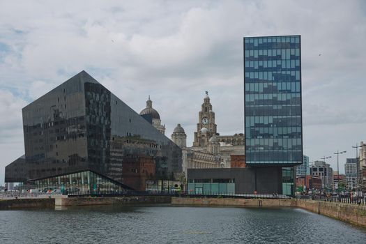 LIVERPOOL, ENGLAND, UK - JUNE 07, 2017: Modern building of Museum of Liverpool and Open Eye Gallery in Liverpool in UK viewed from Canning Dock