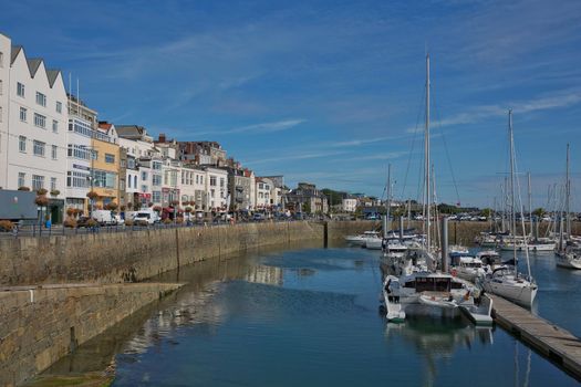 ST. PETER PORT, GUERNSEY, UK - AUGUST 16, 2017: Scenic view of a bay in St. Peter Port in Guernsey, Channel Islands, UK.