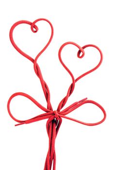 red shoe lace in a shape of two hearts