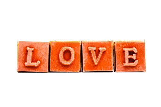 red rubber stamps forming the word love