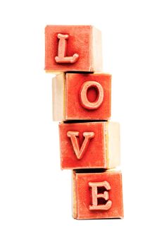red rubber stamps forming the word love