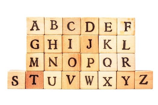 the alphabet on wooden cubes isolated on white