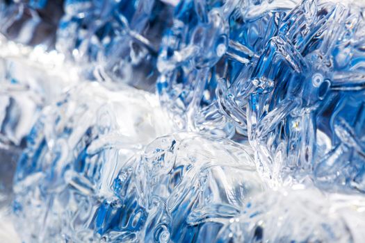 pile of plastic bottles of half litre with blue cap