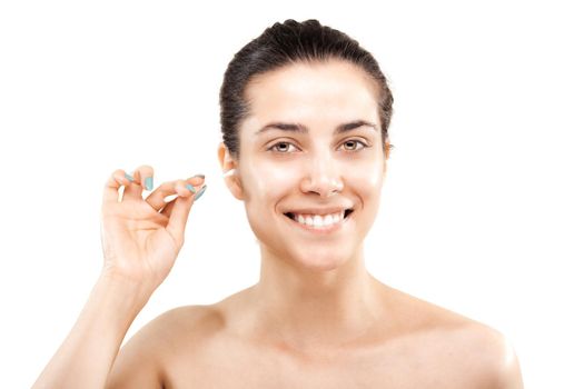 happy girl cleaning her ear with cotton stick