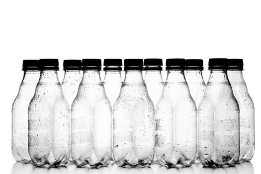 group of small empty plastic bottles, isolated on white background