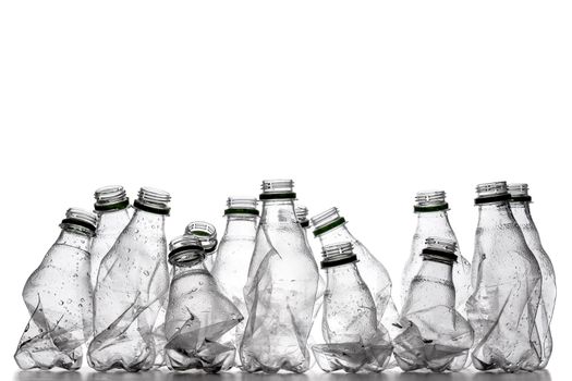 group of smashed empty plastic bottles, isolated on white background