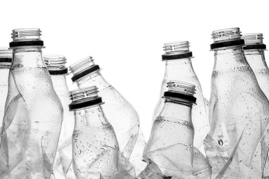 group of smashed empty plastic bottles, isolated on white background