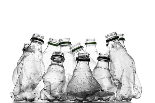 group of smashed empty plastic bottles, isolated on white background