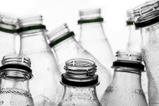 group of smashed empty plastic bottles, isolated on white background