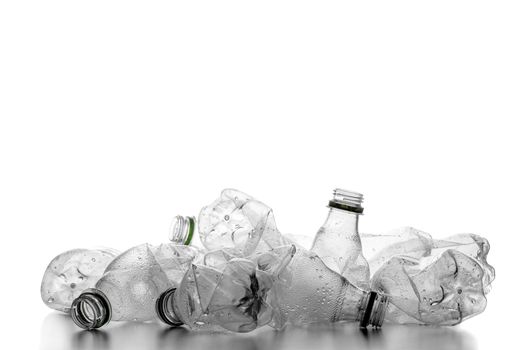group of smashed empty plastic bottles, isolated on white background