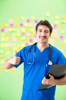 Young doctor with many reminders and urgent work