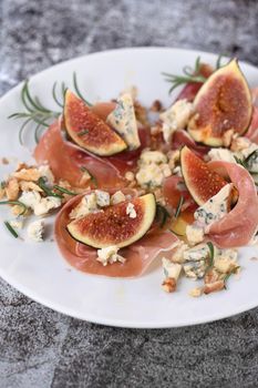 Figs with Parma ham with blue cheese, nuts and honey
