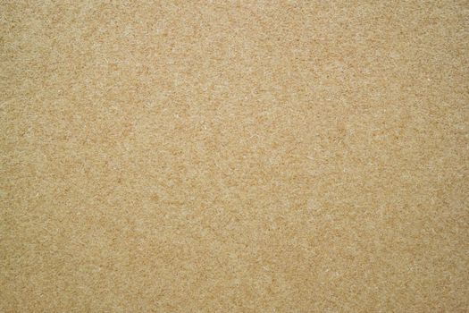 A dense industrial sheet of paper with a textured surface