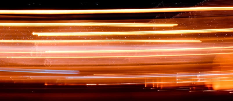 Abstract light trails on the dark background