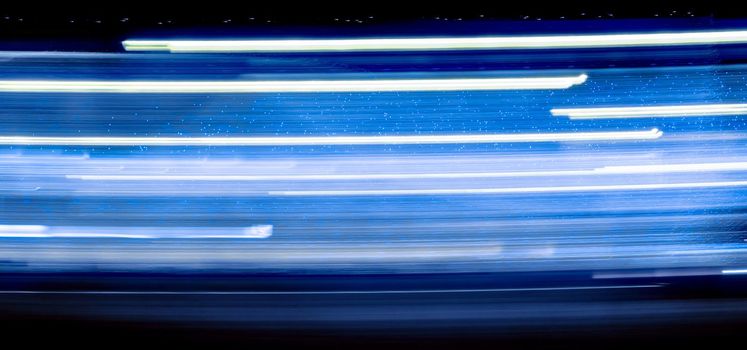 Abstract light trails on the dark background