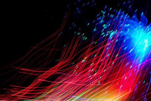 Abstract motion curved lights on dark background
