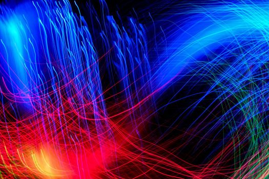 Abstract motion curved lights on dark background