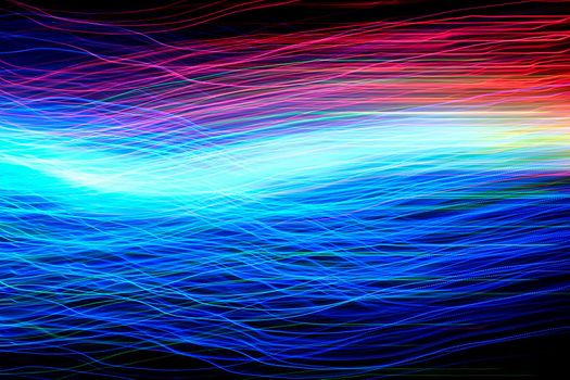 Abstract motion curved lights on dark background