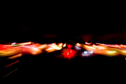 Abstract motion defocused lights on dark background