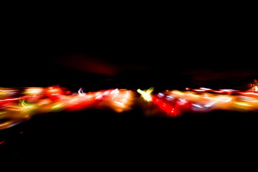 Abstract motion defocused lights on dark background