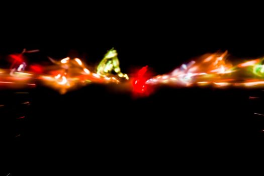 Abstract motion defocused lights on dark background