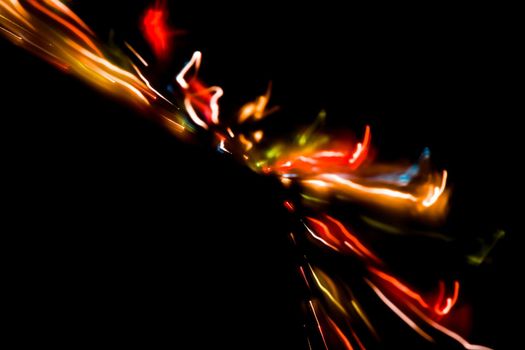 Abstract motion defocused lights on dark background