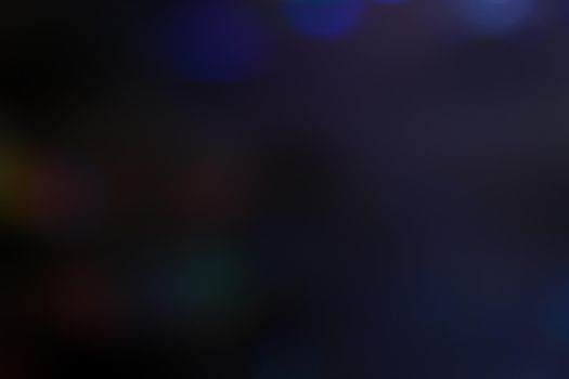Abstract motion defocused lights on dark background