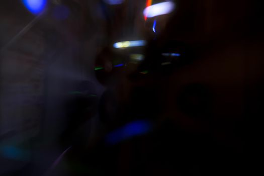Abstract motion defocused lights on dark background