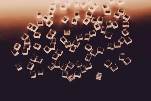 abstract plastic parallelepipedic shapes on a dark background