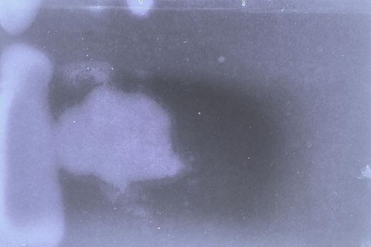 Aging, worn paper with water stains and rough edges