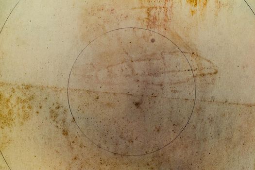 Aging, worn paper with water stains and rough edges
