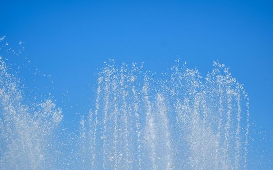 artesian fountain on blue sky