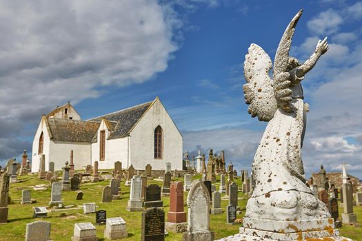 CAITHNESS, SCOTLAND, UK - AUGUST 08, 2017: Graveyard at Canisbay church, the most northerly parish church on the Scottish mainland, near John O'Groats.