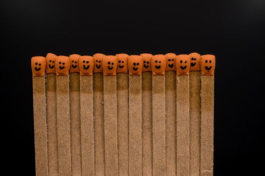 matchsticks with faces painted on the heads