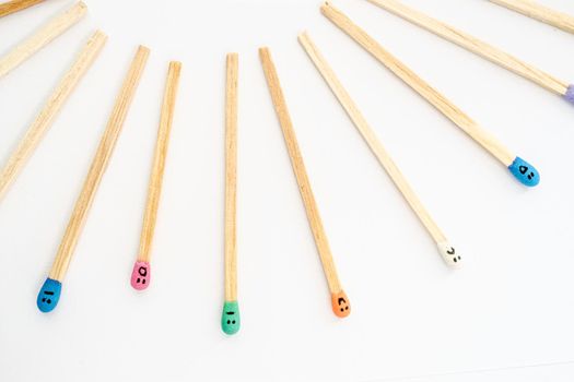 matchsticks with faces painted on the heads