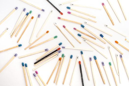 Multicolored matchsticks with faces painted on the heads