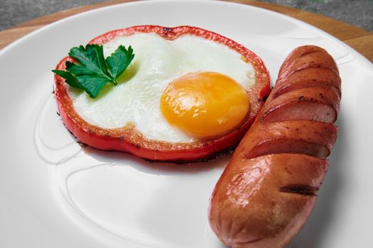 fried egg with red bell pepper on the plate.