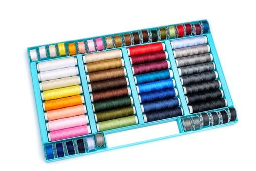 spools of thread in plastic box
