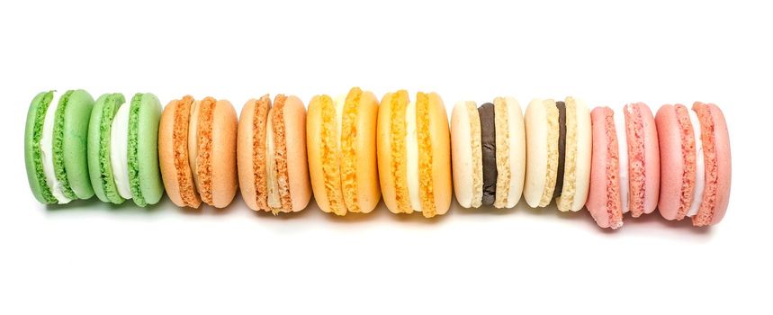 Sweet and colourful french macaroons or macaron on white background