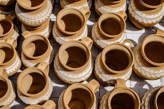 unburned clay vessels on table