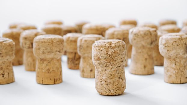 Used corks plugs from different champagne  producing on white background