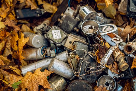 various metal things thrown in the woods