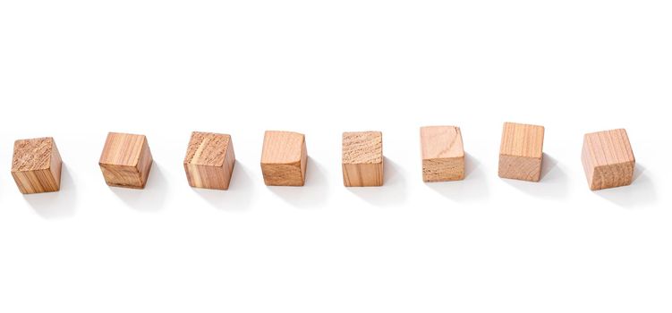 Wooden cubes in row isolated on white