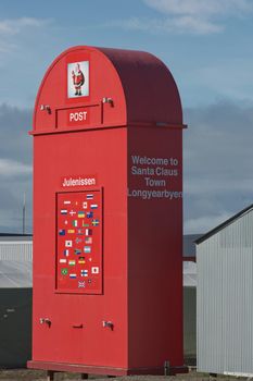 Longyearbyen, Svalbard, Norway - July 22, 2017: Giant red mailbox for the Santa Claus in front of the Post Office in Longyearbyen, Spitsbergen, Norway