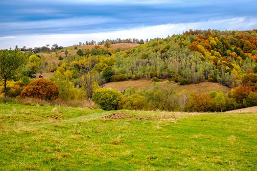 Colorful autumn landscape in the Romanian Carpathians, Fantanele village, Sibiu county, Cindrel mountains, 1100m, Romania