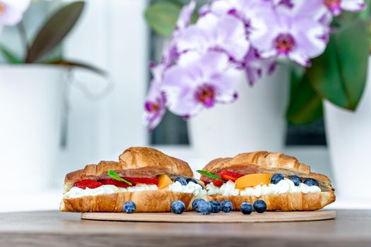 golden roasted croissant filled with vanilla cream, blueberries, peaches and strawberries.