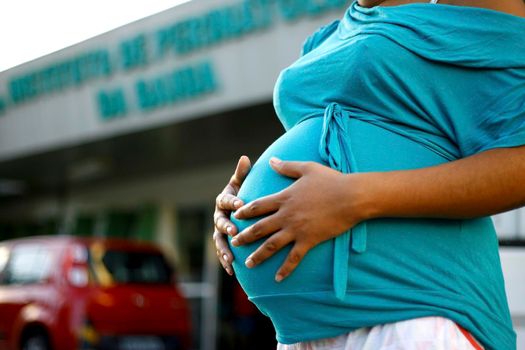 salvador, bahia / brazil - august 8, 2014: Pregnant woman is seen at the entrance of the Bahia Perinatology Institute in Salvador.