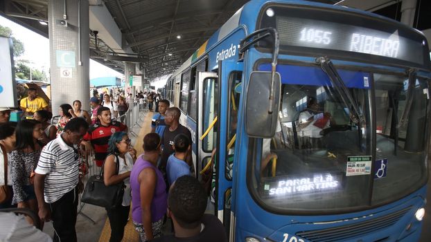 salvador, bahia / brazil - september 8, 2017: Passengers are seen while boarding buses at Mussurunga Station in Salvador.