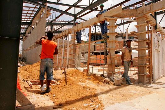 porto seguro, bahia / brazil - october 8, 2010: Workers are seen working and refurbishing the airport in the city of Porto Seguro.




